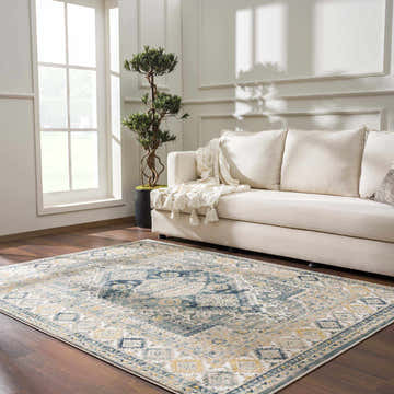 Living room scene with Brend Blue Medallion Area Rug, beige sofa, and wood floors. Farmhouse style. Roomscene-Rectangle