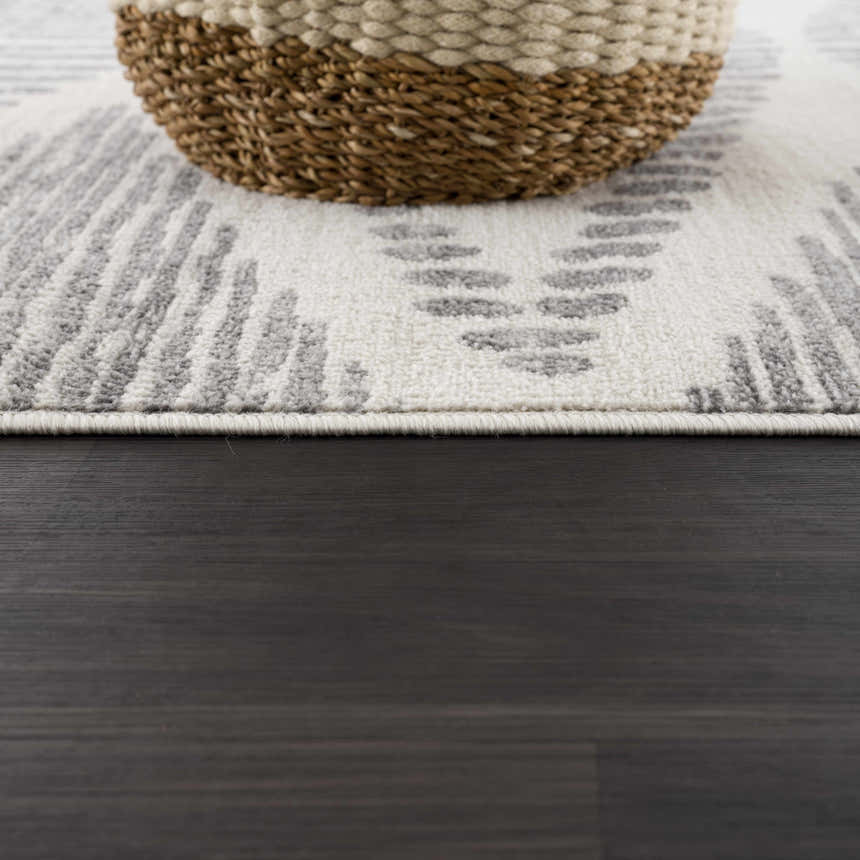 Close-up of Tigrisis Ivory 2327 area rug showing gray Moroccan design, ivory background, and texture. Styleshot