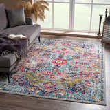 Living room scene with a gray sofa and the bright floral New Delanson Area Rug. Roomscene-Rectangle