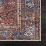 Close-up of Rust Baki Traditional Washable Area Rug showing Persian design, rust, blue, and off-white colors, and textured weave. Swatch