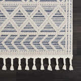 Close-up of the Magnolia Blue 2302 Area Rug, featuring a geometric pattern in cream and dark blue with braided tassels. Swatch