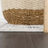 Close-up of the Magnolia Blue 2302 Area Rug showing cream and blue geometric pattern and texture, with a ruler for scale. Pile