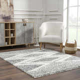 Living room scene with charcoal and cream Trunding Plush Area Rug, white chair, and wood cabinet. Roomscene-Rectangle