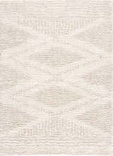 Close-up of the Hauteloom Trunding Plush Rug in light beige, showing its shag texture and subtle high-low design. Design-Rectangle-537