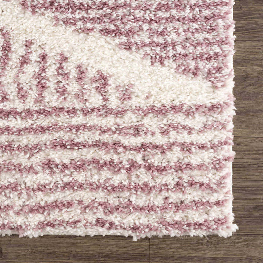 Close-up of the Trunding Plush in Pink Area Rug. Cream and pink shag rug with a high-low pile and a soft, textured feel. Swatch