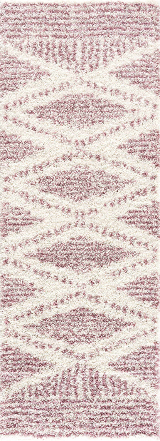 Close-up of the Trunding Plush in Pink Area Rug. Shag rug with cream and pink geometric pattern. Design-Runner
