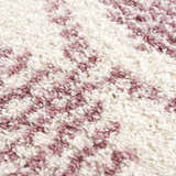 Close-up of the Trunding Plush pink area rug. Cream and pink shag rug texture detail. Contemporary style. Texture