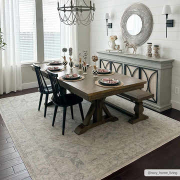Farmhouse dining room with wood table, black chairs, and Deena Thick Luxe Area Rug in gray. Roomscene-Rectangle