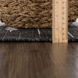 Close-up of the Frankville Black&White Performance Rug showing texture, pile height with a ruler, and pattern detail. Pile