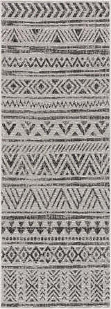 Close-up of the Catrine Indoor & Outdoor Rug. Black, charcoal, and off-white geometric pattern. Bohemian style. Design-Runner-2773
