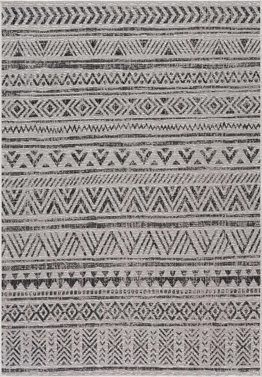 Close-up of the Catrine Indoor & Outdoor Rug, showcasing its black and white bohemian-inspired geometric pattern and woven texture. Design-Rectangle-5373
