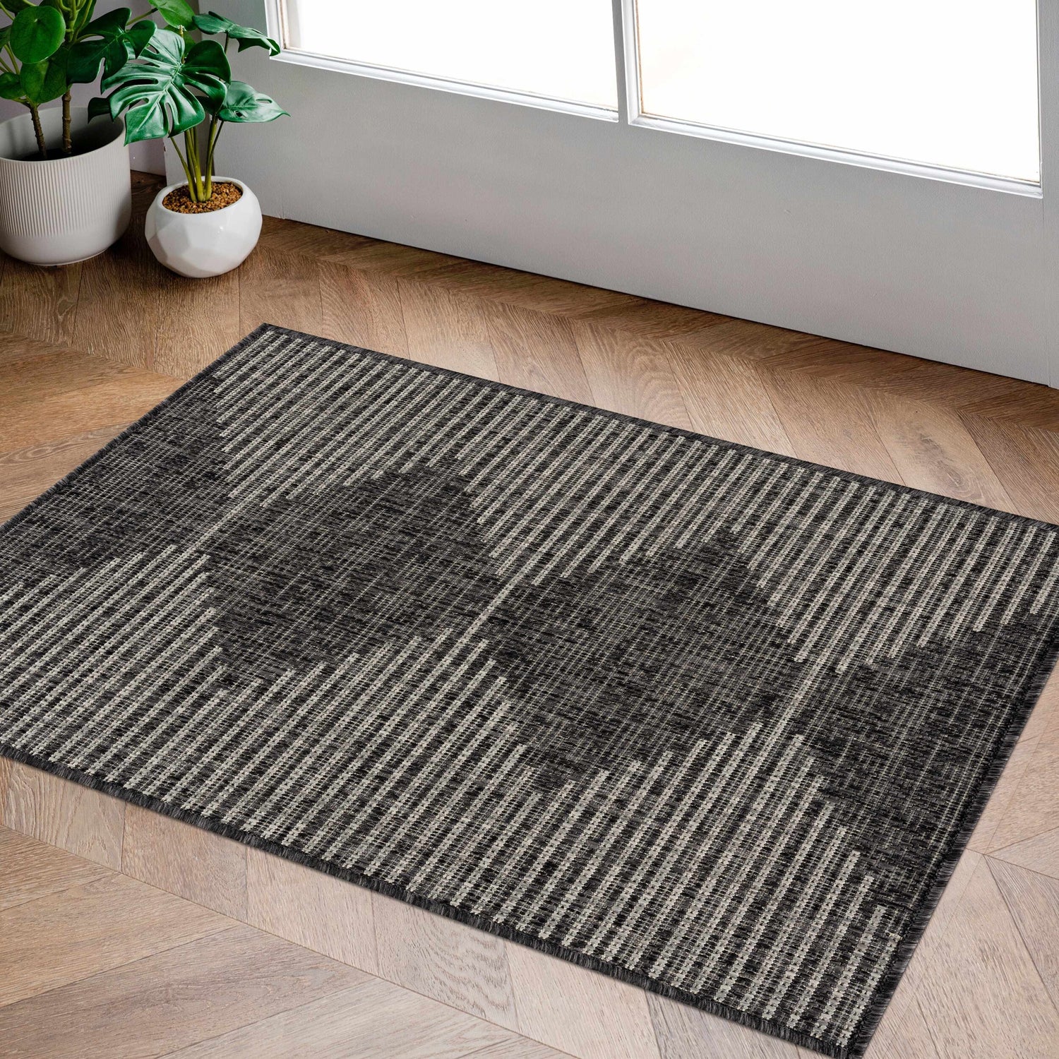 Entryway with Stephan Area Rug in black, charcoal, cream, and light gray. Contemporary Southwestern style on wood floors. Roomscene-Rectangle