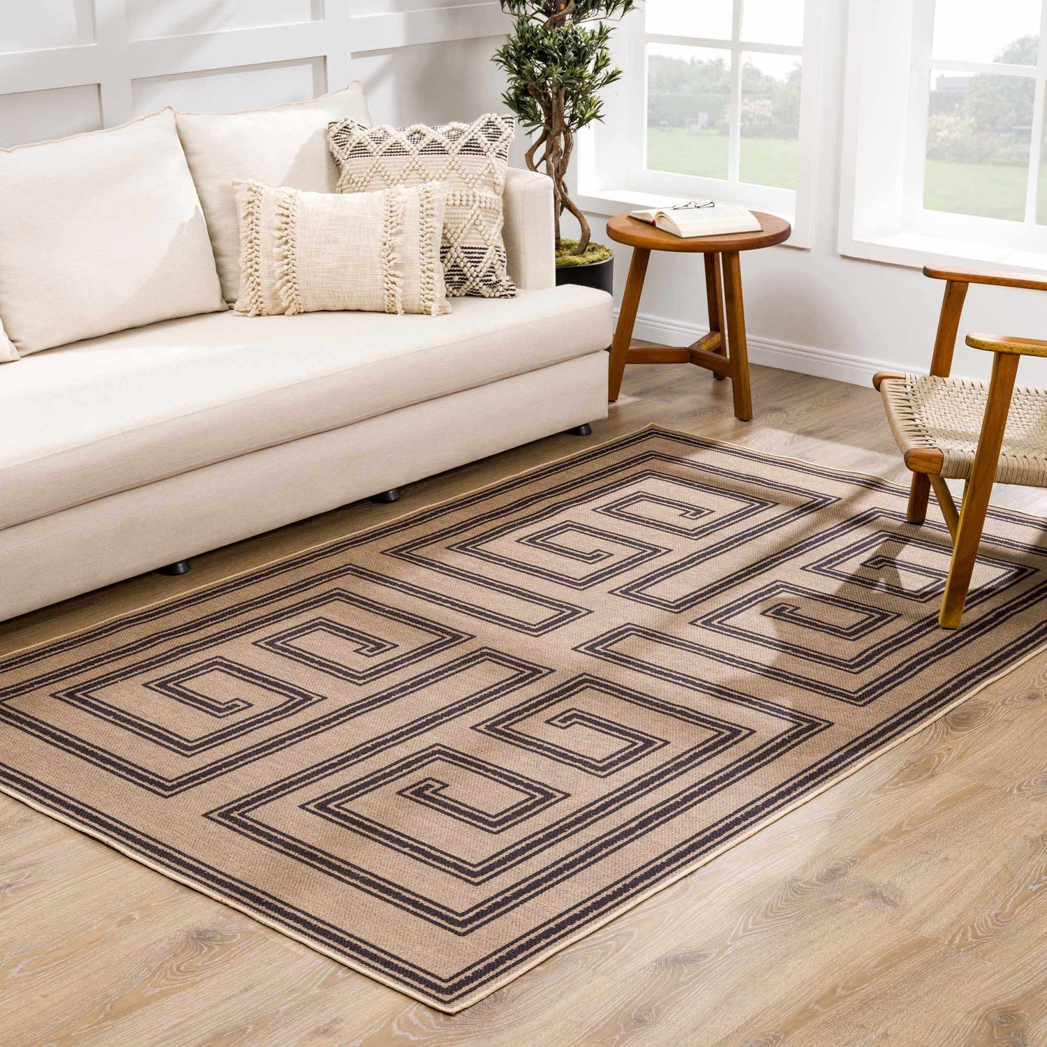 Living room with a Coty Washable Jutely Rug in natural jute and charcoal. Farmhouse style with sofa, wood chair, and side table. Roomscene-Rectangle