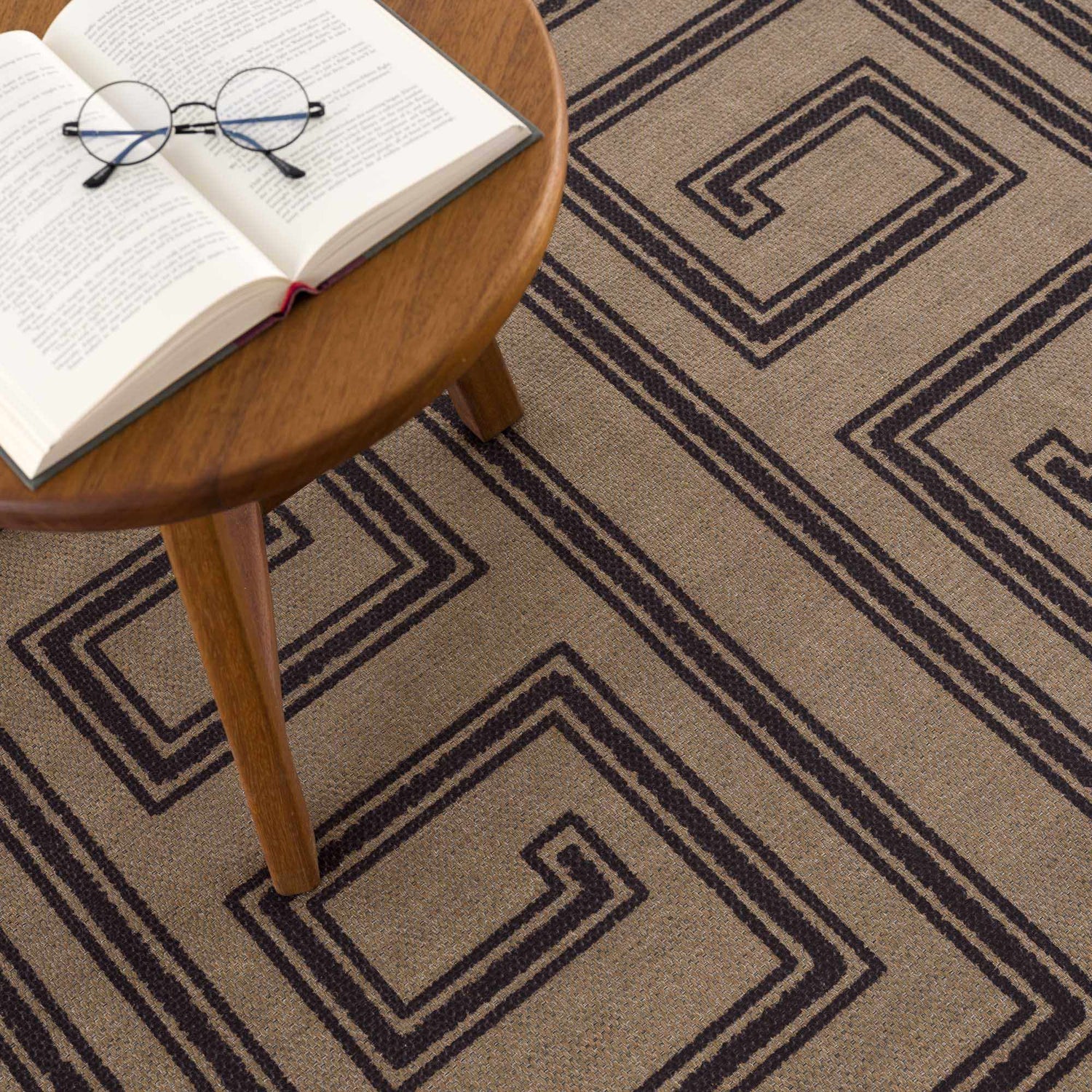 Close-up of the Coty Washable Jutely Rug showing its geometric pattern and natural jute texture in brown and charcoal. Styleshot