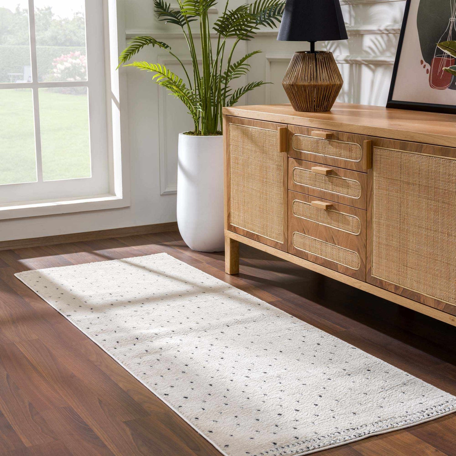 Entryway with wood floors and a beige Julie Area Rug runner with black polka dots. Roomscene-Runner