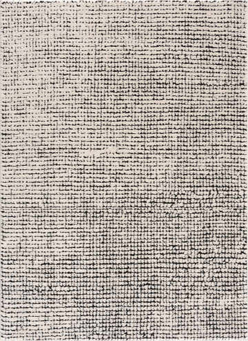 Close-up of the Keita Cream & Black Grid Plush Rug. Features a geometric grid pattern and plush texture. Design-Rectangle-537