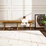 Entryway with beige Keats Area Rug, wood bench, and modern art. Contemporary style. Roomscene-Rectangle