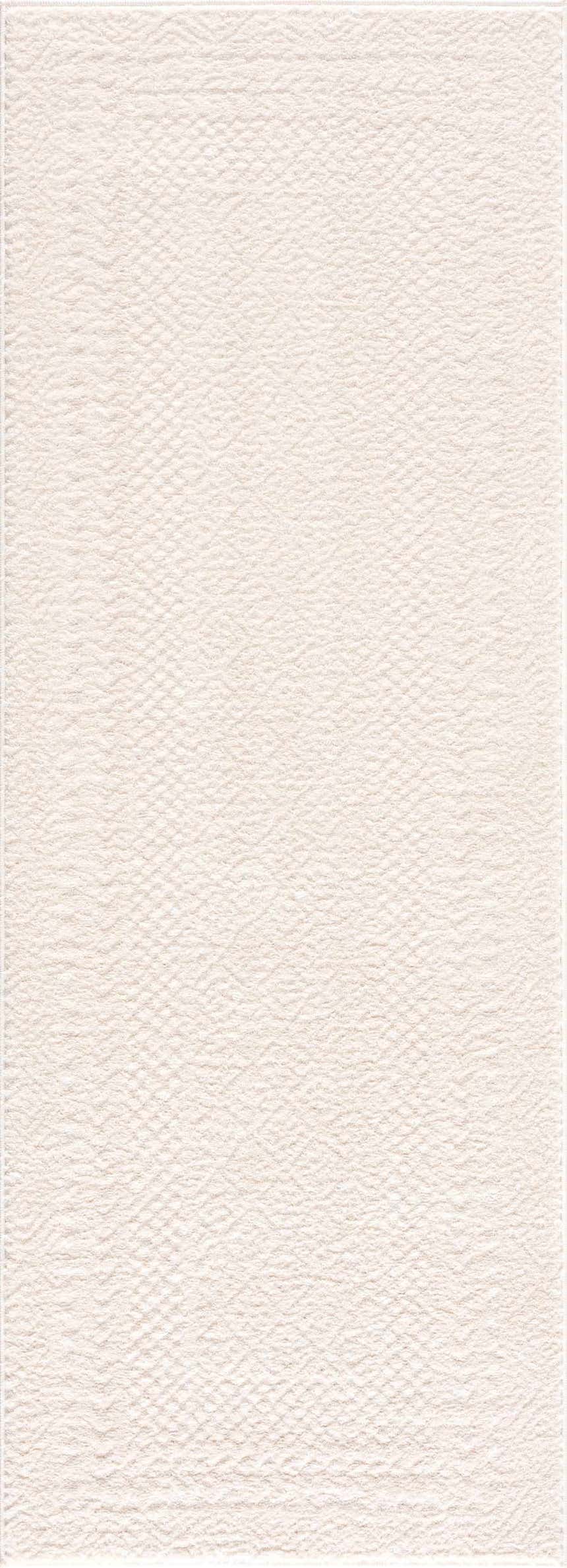 Close-up of the ivory Julio Area Rug. The rug has a subtle, textured pattern. Perfect for a neutral, Scandinavian style. Design-Runner-2773