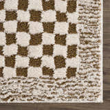 Close-up of the Leryn Brown Checkered Plush Rug. Features a beige and brown checkerboard pattern with a soft, plush texture. Swatch
