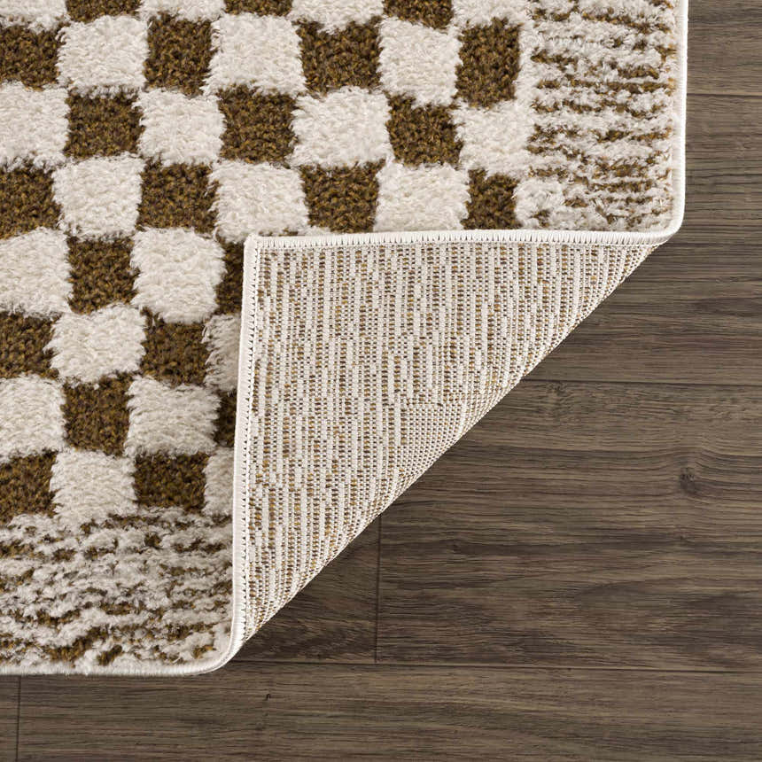 Close-up of Leryn Brown Checkered Plush Rug showing the brown and ivory checkered pattern and rug backing. Fold