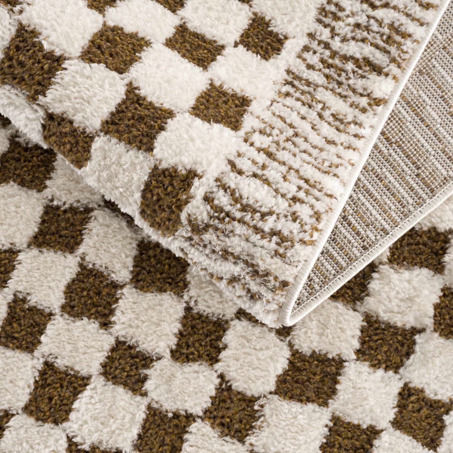 Close-up of the plush Leryn Brown Checkered Rug. Beige and brown checkered pattern, soft texture. Fold