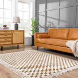 Living room scene with a Leryn Brown Checkered Plush Rug, tan leather sofa, and wood cabinet. Neutral, mid-century modern style. Roomscene-Rectangle
