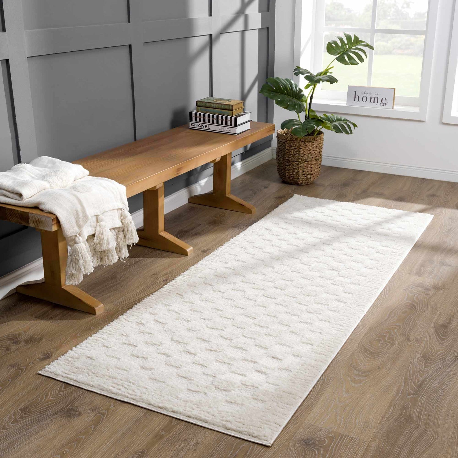 Entryway with wood bench and ivory Leryn Checkered Area Rug runner on wood floor. Roomscene-Runner