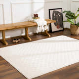 Entryway with Leryn Ivory Checkered Area Rug, wood bench, art, and plant. Neutral, inviting, and contemporary style. Roomscene-Rectangle