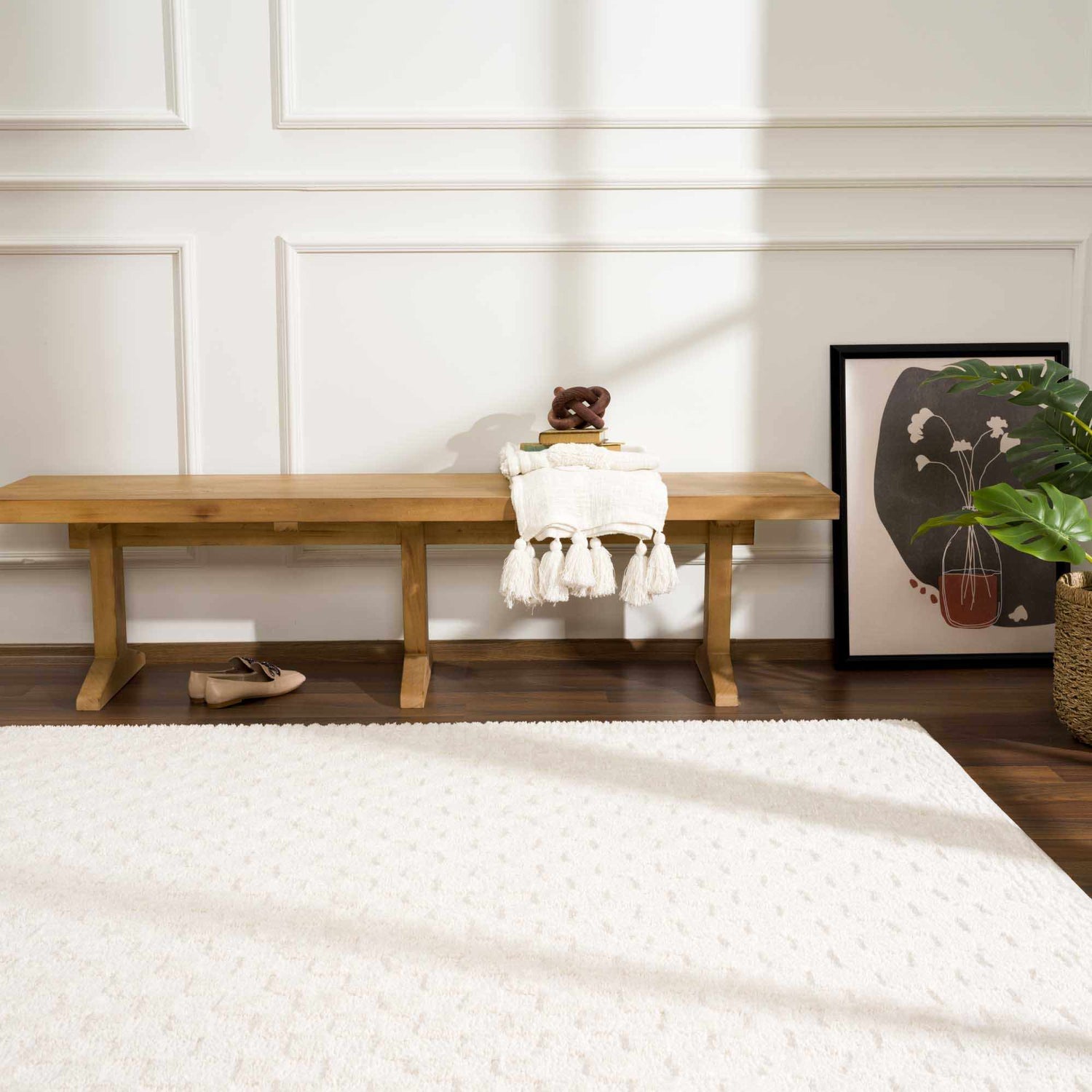 Entryway with a light wood bench and ivory Leryn Checkered Area Rug on a dark wood floor. Roomscene-Rectangle