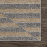 Close-up of Webuye 3D Outdoor Area Rug. Gray geometric pattern on a light peach woven background. Contemporary style. Swatch