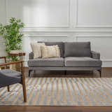 Living room scene with gray sofa and Webuye 3D Outdoor Area Rug in dark gray, dusty sage, and multi brown geometric pattern. Roomscene-Rectangle