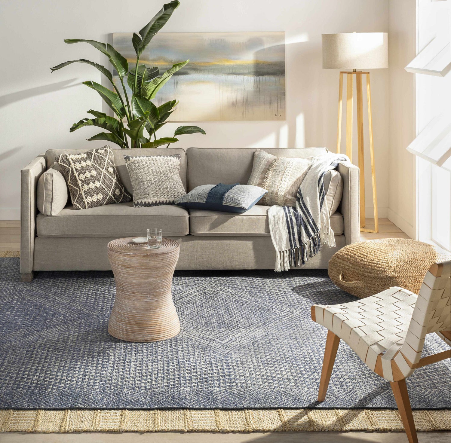 Living room scene with a gray sofa and the blue Moyne Area Rug. Roomscene-Rectangle