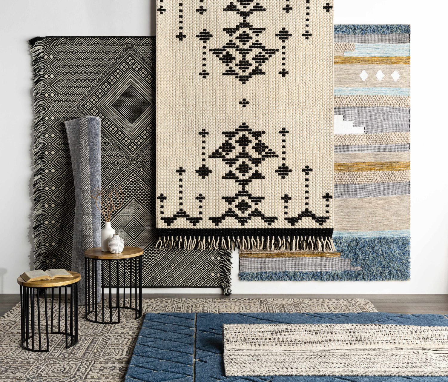 Styled rug scene with Ravendale Area Rug in cream, gray, and slate. Bohemian, contemporary rugs are displayed on a wood floor. Styleshot