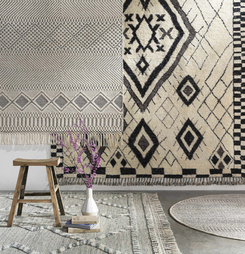 Styled room scene with geometric patterned Tubao Area Rugs in brown, gray, and ivory. Bohemian, farmhouse style. Styleshot
