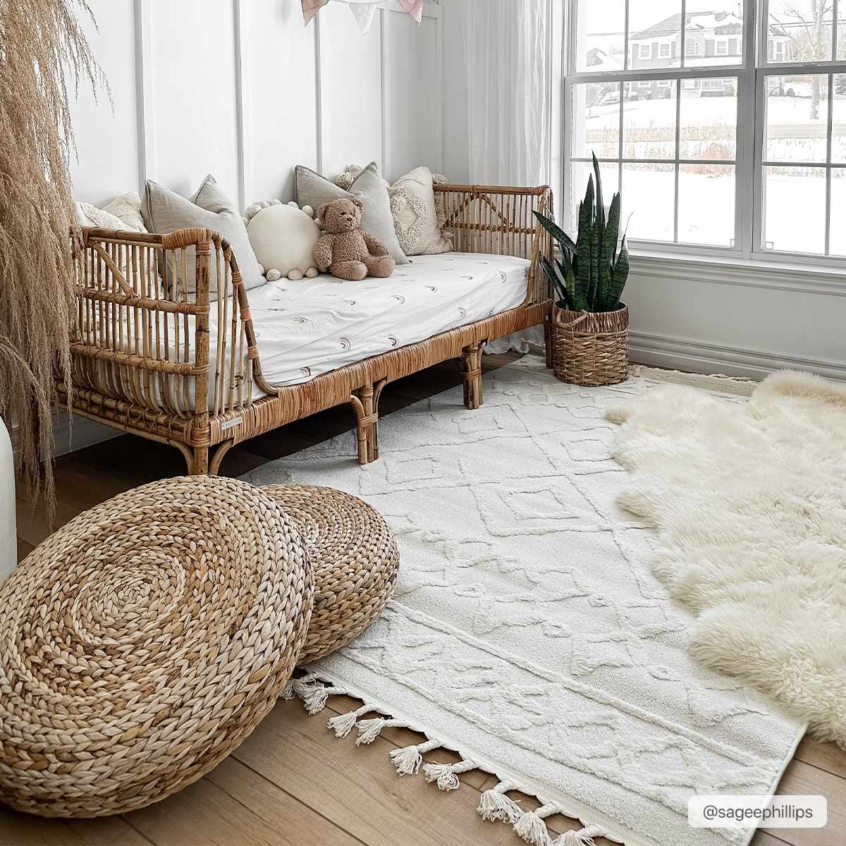 Bright kids room with rattan daybed, woven poufs, and geometric Gyundyukoru Area Rug in bone and cream. Roomscene-Rectangle