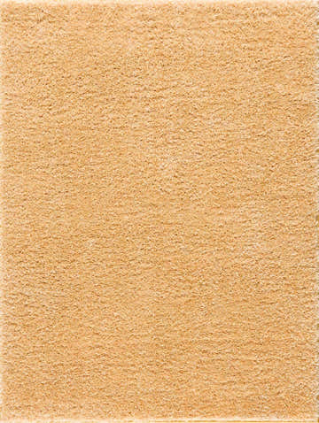 Close-up of the plush texture of the Faina Solid Gold Shag Washable Area Rug. Soft, golden, and inviting. Design-Rectangle-46