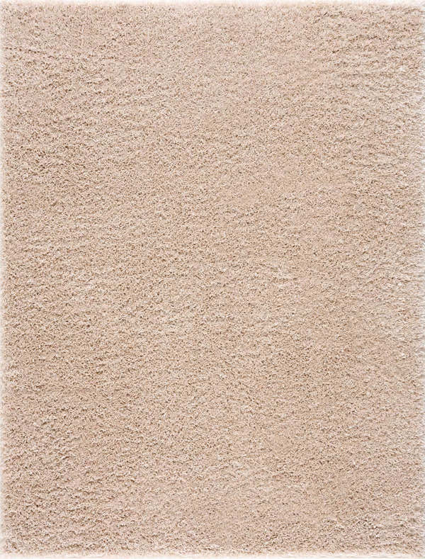 Close up of the plush texture of the Faina Solid Beige Shag Washable Area Rug. Design-Rectangle-46