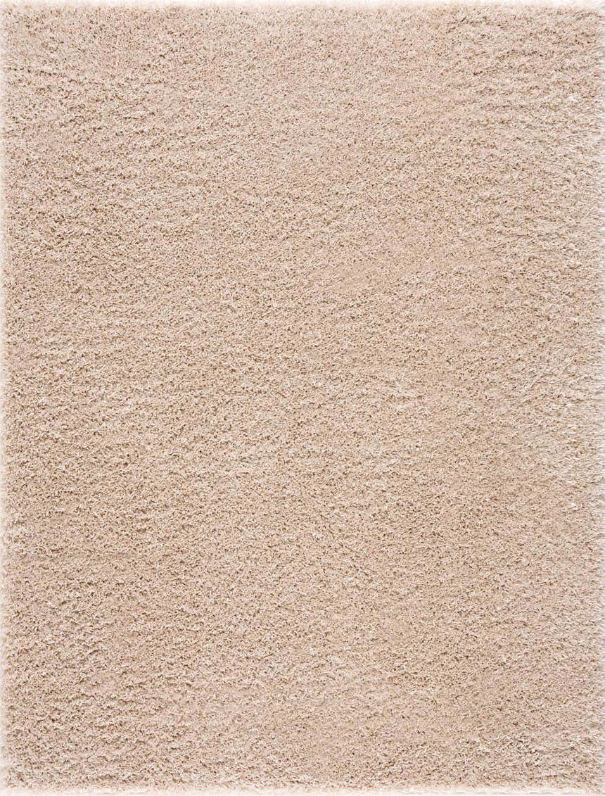 Close up of the plush texture of the Faina Solid Beige Shag Washable Area Rug. Design-Rectangle-46