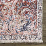 Close-up of the Burgundy Holi-2303 Washable Area Rug showing its traditional vintage design, fringe, and burgundy color palette. Swatch