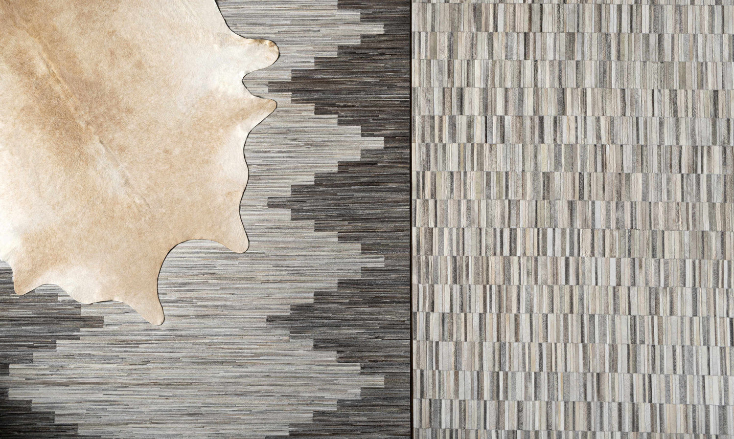 Close-up of Shearwater Premium Rug - Clearance, featuring beige, charcoal, and gray hide patterns and textures. Styleshot