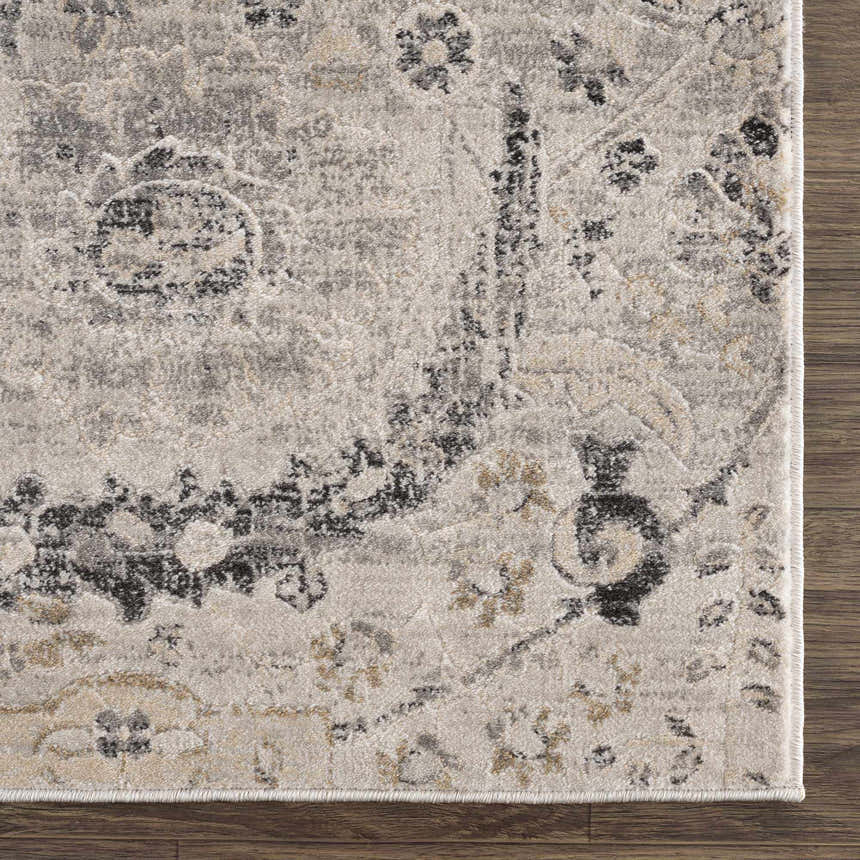 Close-up of the Georgiana Area Rug. Beige, black, and gray floral pattern on a soft, textured polypropylene rug. Swatch