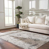 Living room with a beige sofa and Georgiana Area Rug in beige, black, and gray on a wood floor. Roomscene-Rectangle