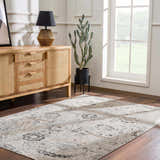 Living room scene with a beige, black, and gray Georgiana Area Rug, wood floors, and a sideboard. Roomscene-Rectangle