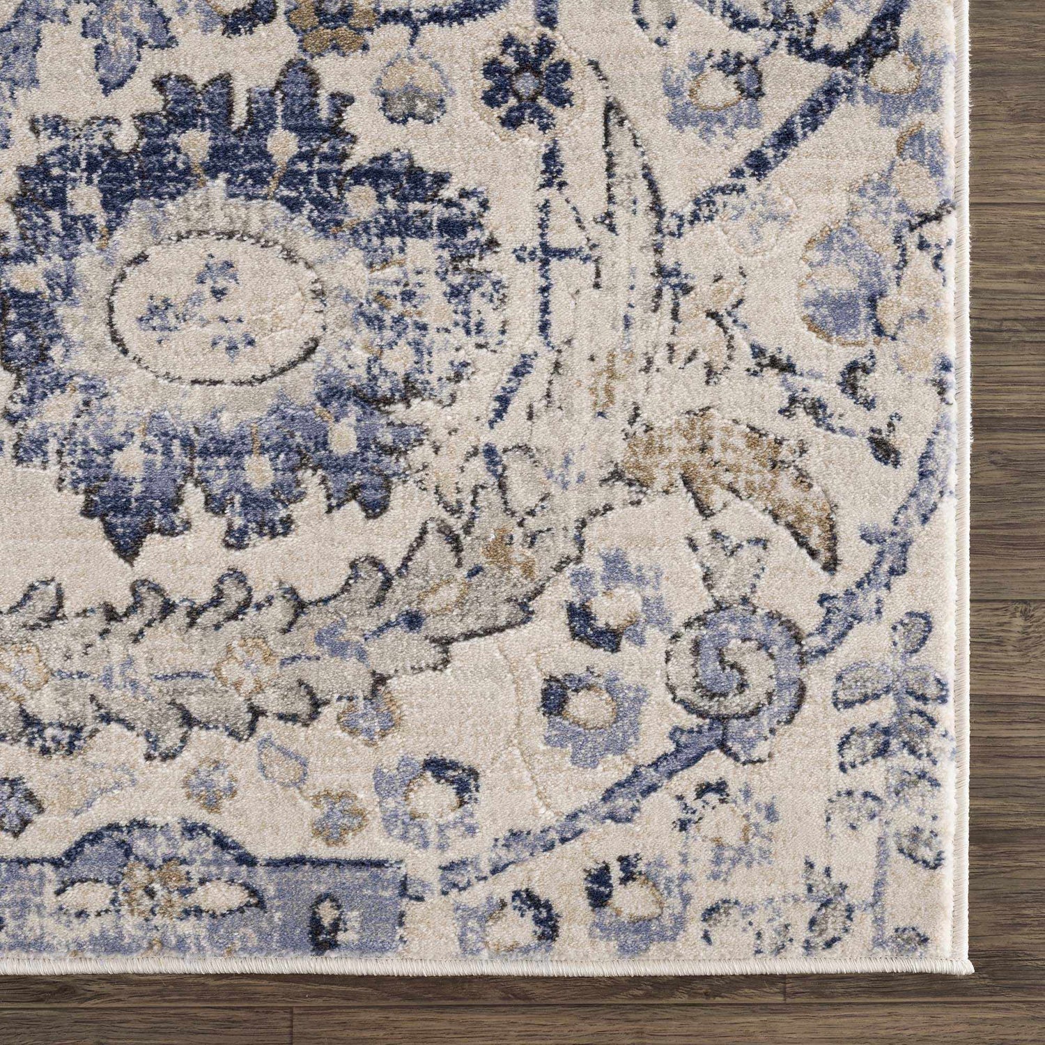 Close-up of the Georgiana Blue & Beige Oushak Rug showing its floral, bohemian pattern and soft, neutral texture. Swatch
