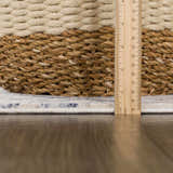 Close-up of the Georgiana Blue & Beige Oushak Rug showing the rug's pile height with a ruler and a basket. Pile
