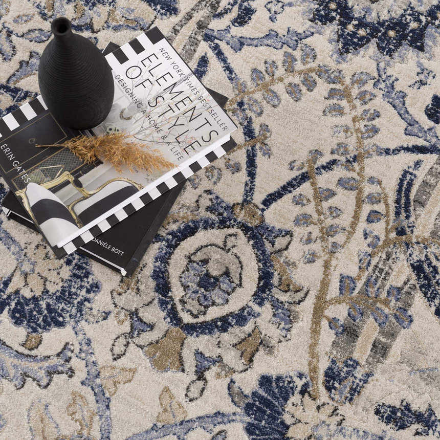 Close-up of the Georgiana Blue & Beige Oushak Rug, showcasing its floral, bohemian pattern and soft beige, blue, and tan colors. Styleshot