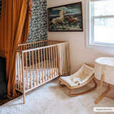 Nursery with crib, rocker, and Julio Ivory Area Rug. Warm, cozy, and inviting kids room. Roomscene-Rectangle