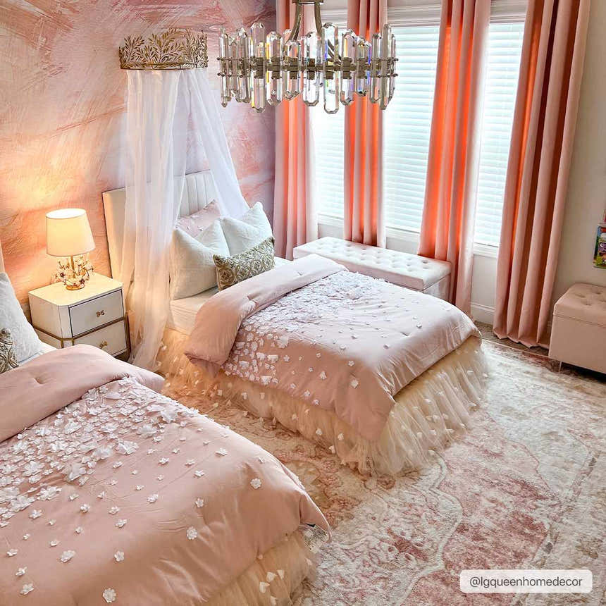 Blush pink kids bedroom with two beds, crystal chandelier, and Kandos Blush & Light Pink Area Rug. Roomscene-Rectangle