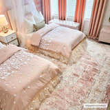 Pink kids bedroom with two beds on a Kandos Blush & Light Pink Area Rug. Roomscene-Rectangle