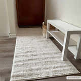 Entryway with a Keanu Ivory Area Rug runner, white bench, wood floors, and neutral decor. Roomscene-Runner